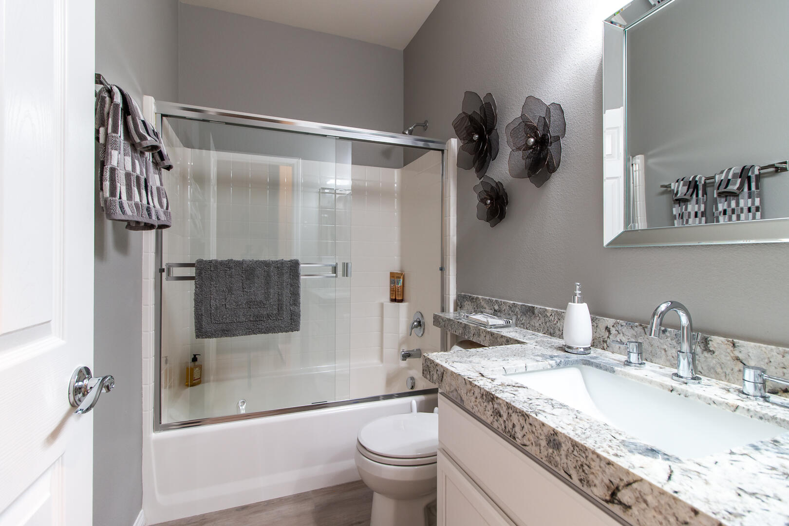 60290 Sweetshade Lane La Quinta, CA 92253 - Photo 24 of 28 a bathroom with a granite countertop sink a toilet and shower