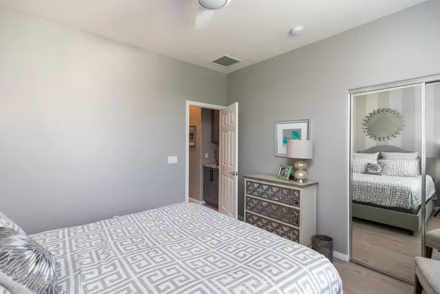 a bedroom with a bed and a dresser