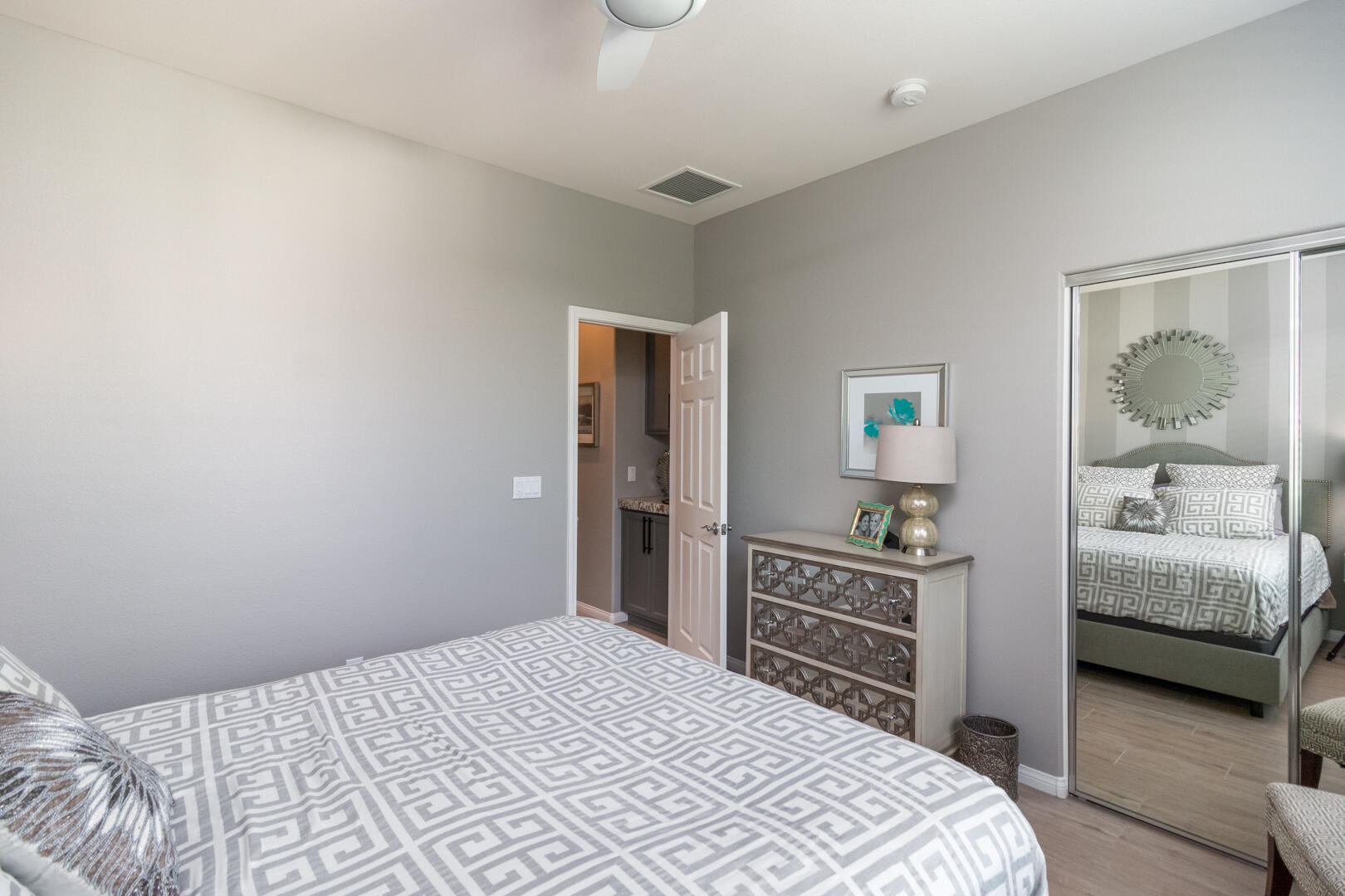 60290 Sweetshade Lane La Quinta, CA 92253 - Photo 27 of 28 a bedroom with a bed and a dresser