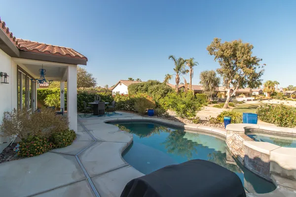 a view of a swimming pool from a balcony