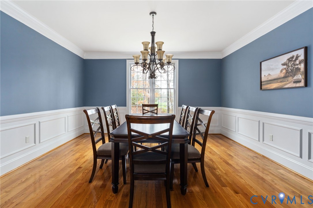 8825 First Branch Lane Chesterfield, VA 23838 - Photo 19 of 63 a view of a dining room with furniture window and wooden floor