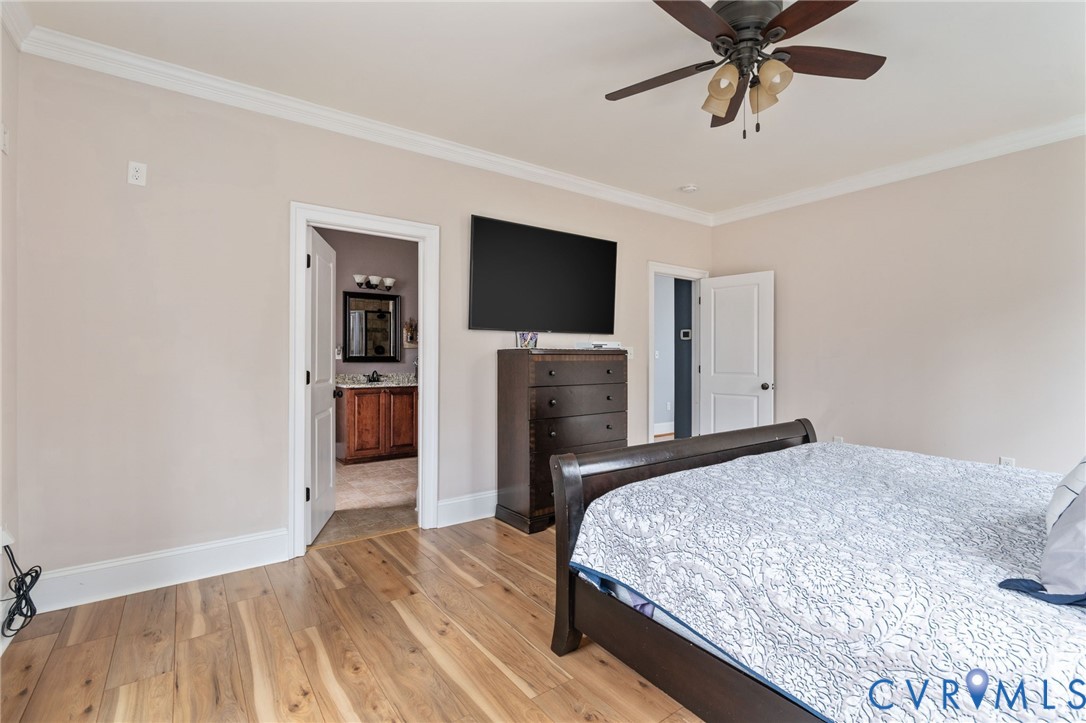 8825 First Branch Lane Chesterfield, VA 23838 - Photo 22 of 63 a bedroom with a bed and a flat screen tv