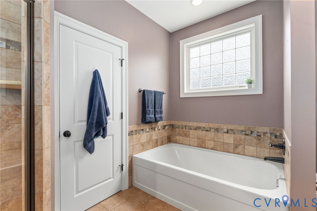 8825 First Branch Lane Chesterfield, VA 23838 - Photo 24 of 63 The main-level primary suite provides a peaceful r