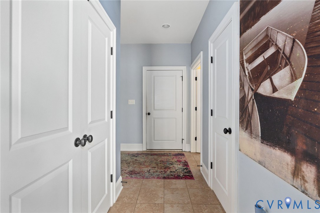 8825 First Branch Lane Chesterfield, VA 23838 - Photo 27 of 63 a view of a hallway with wooden floor and entryway