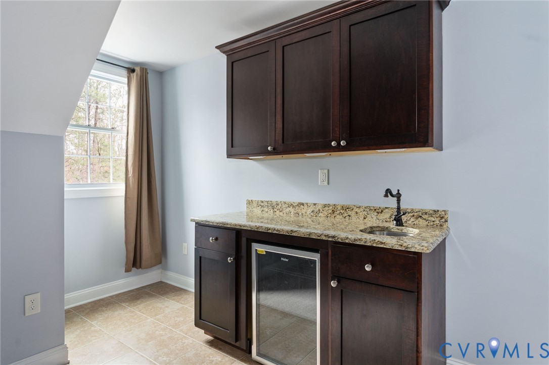 8825 First Branch Lane Chesterfield, VA 23838 - Photo 46 of 63 a bathroom with a granite countertop sink and a mirror