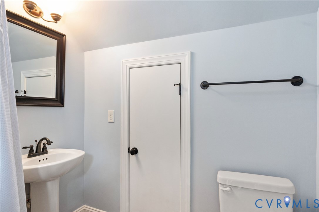 8825 First Branch Lane Chesterfield, VA 23838 - Photo 48 of 63 a bathroom with a sink a toilet and mirror