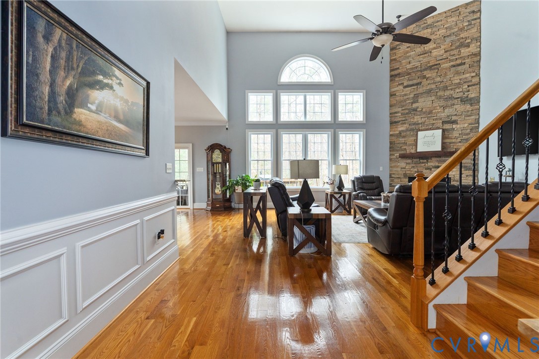 8825 First Branch Lane Chesterfield, VA 23838 - Photo 6 of 63 a view of a livingroom with furniture staircase and a large window