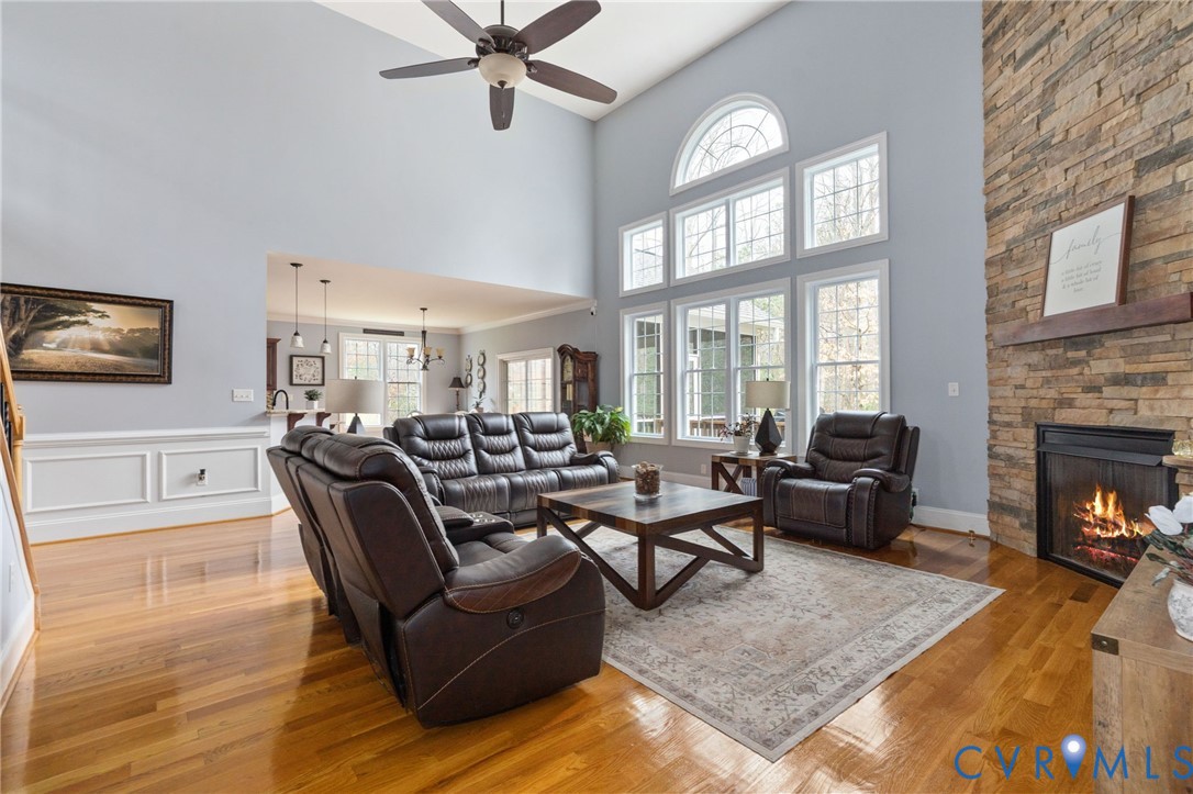 8825 First Branch Lane Chesterfield, VA 23838 - Photo 9 of 63 a living room with furniture fireplace and a window