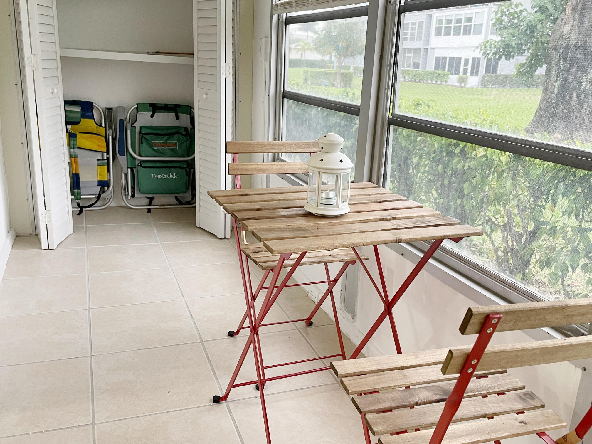 171 Suffolk F, Unit 171 Boca Raton, FL 33434 - Photo 21 of 21 a view of a dining room with furniture window and outside view