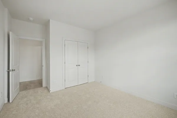 a bathroom with a sink vanity mirror and toilet