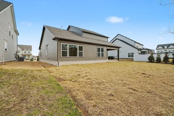 a house view with swimming pool