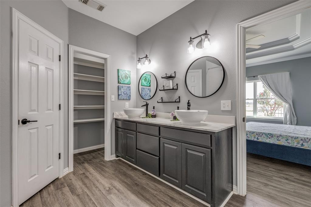 11744 Foutch Road Pilot Point, TX 76258 - Photo 20 of 35 a bathroom with a double vanity sink and a mirror
