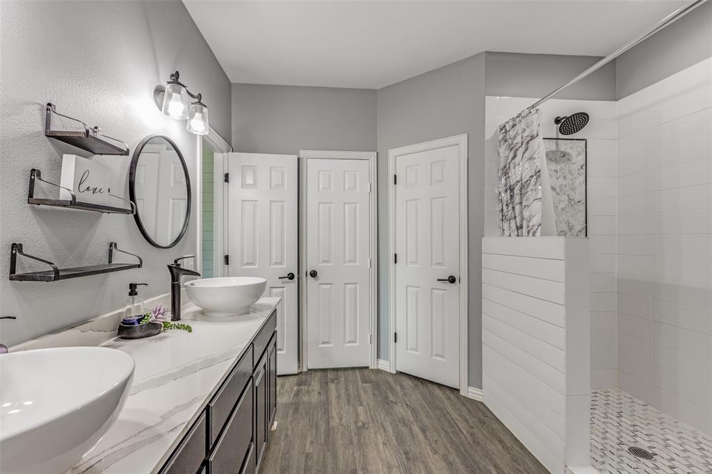 11744 Foutch Road Pilot Point, TX 76258 - Photo 21 of 35 a bathroom with a sink and a mirror
