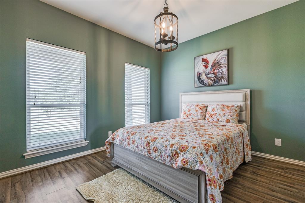 11744 Foutch Road Pilot Point, TX 76258 - Photo 24 of 35 a bedroom with a large bed and a window