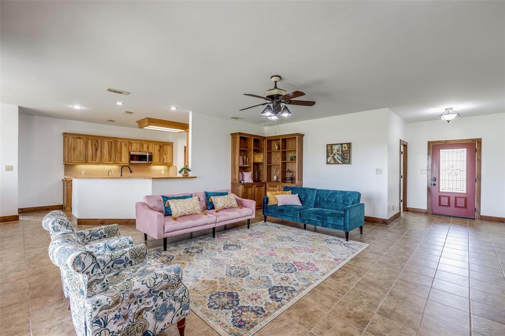 11744 Foutch Road Pilot Point, TX 76258 - Photo 7 of 35 a living room with furniture and wooden floor