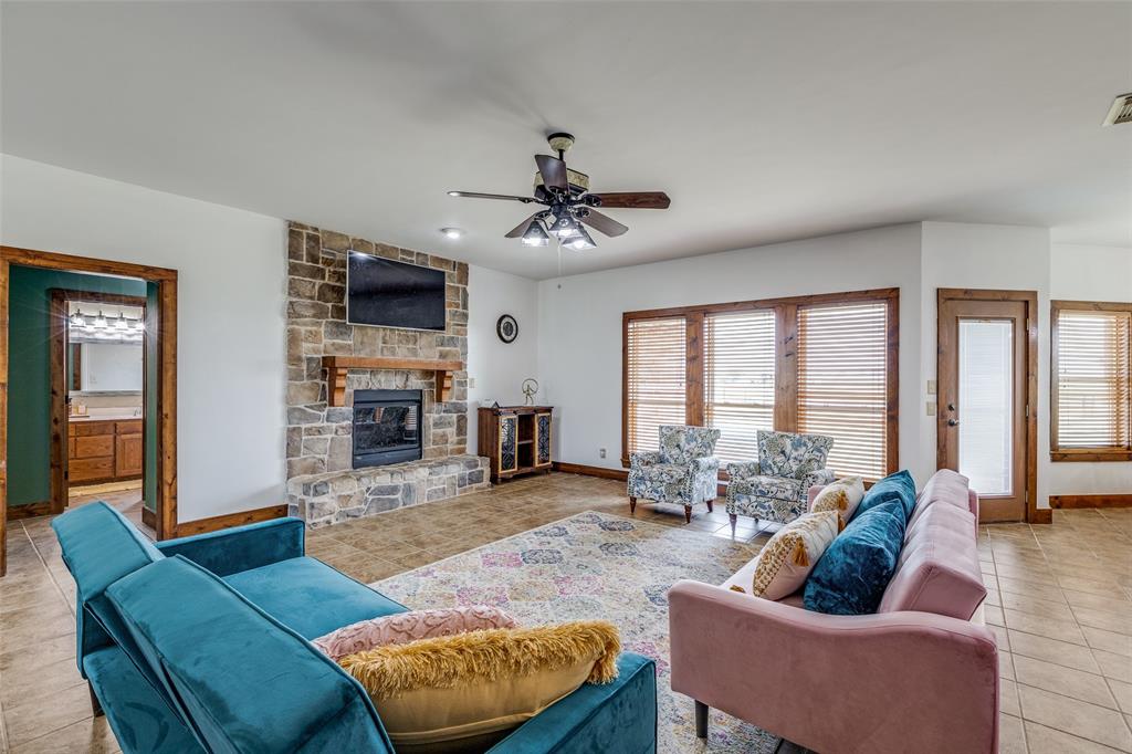 11744 Foutch Road Pilot Point, TX 76258 - Photo 8 of 35 a living room with furniture and a large window