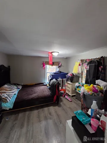 a bedroom with bed and a couch