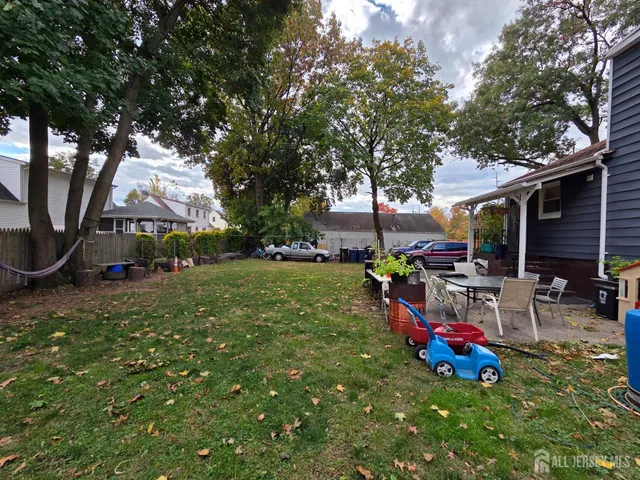 a view of outdoor space with garden and patio