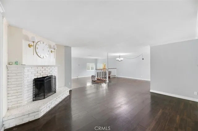 a workspace with wooden floor and windows