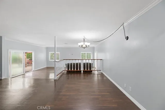 a large white kitchen with a large window