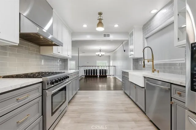 a bathroom with a toilet sink and shower