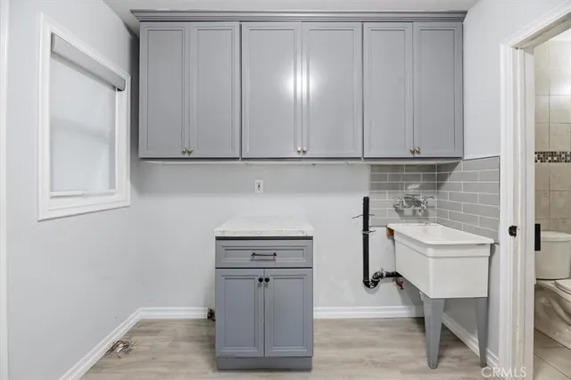 a bedroom with a bed and a potted plant