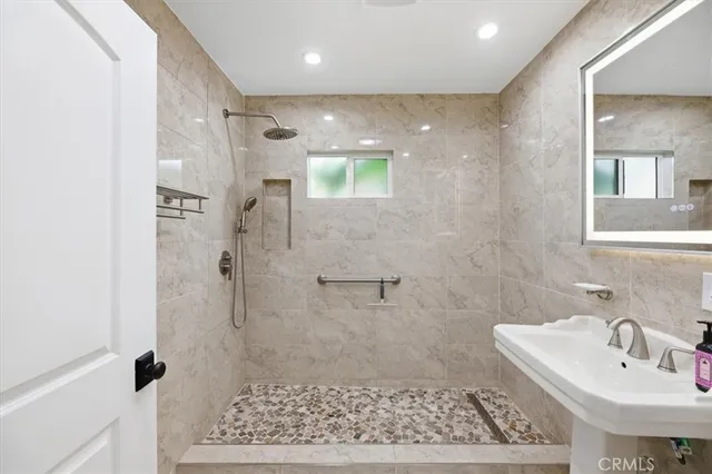 a patio with a table and chairs under an umbrella