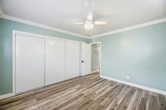 a patio with a table and chairs under an umbrella