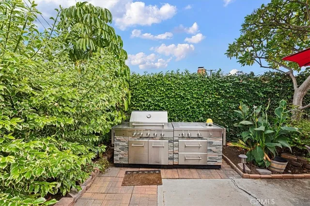 an aerial view of multiple houses with a yard