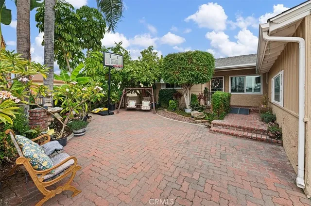 a living room with furniture a rug and a fireplace