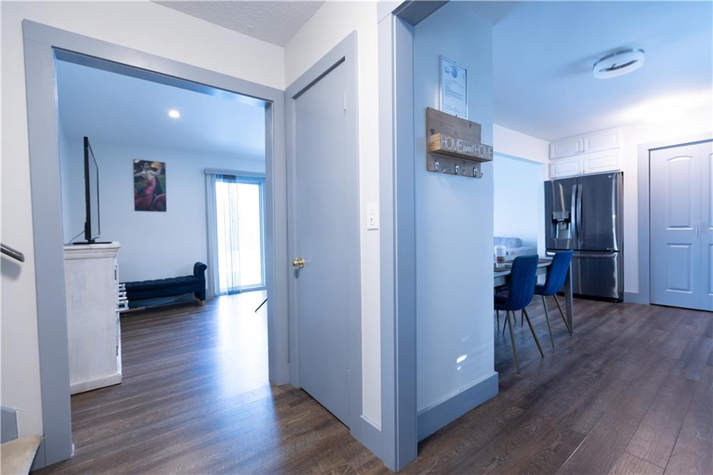 4735 North Springs Road Northwest Kennesaw, GA 30144 - Photo 11 of 34 a view of a hallway with wooden floor and a living room