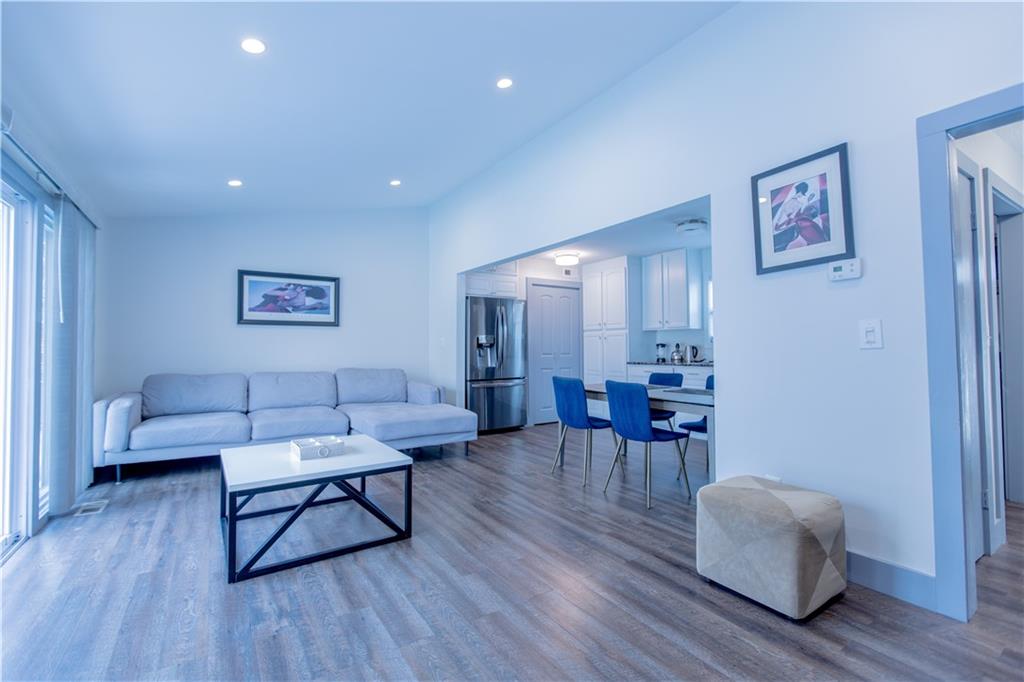 4735 North Springs Road Northwest Kennesaw, GA 30144 - Photo 14 of 34 a living room with furniture and a wooden floor