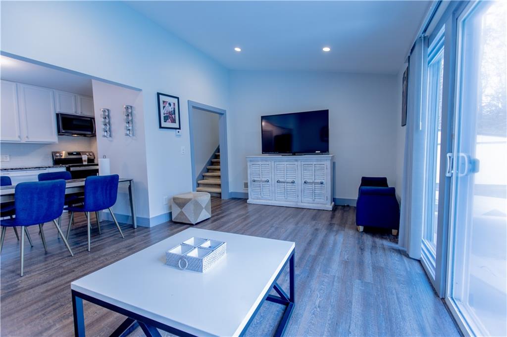 4735 North Springs Road Northwest Kennesaw, GA 30144 - Photo 15 of 34 a living room with furniture and a flat screen tv