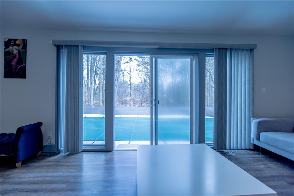 4735 North Springs Road Northwest Kennesaw, GA 30144 - Photo 16 of 34 a view of a livingroom with furniture and wooden floor