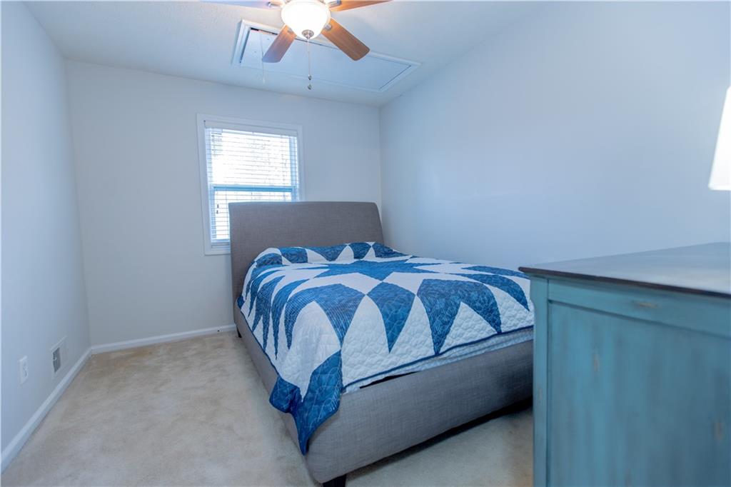 4735 North Springs Road Northwest Kennesaw, GA 30144 - Photo 19 of 34 a bedroom with a bed and window