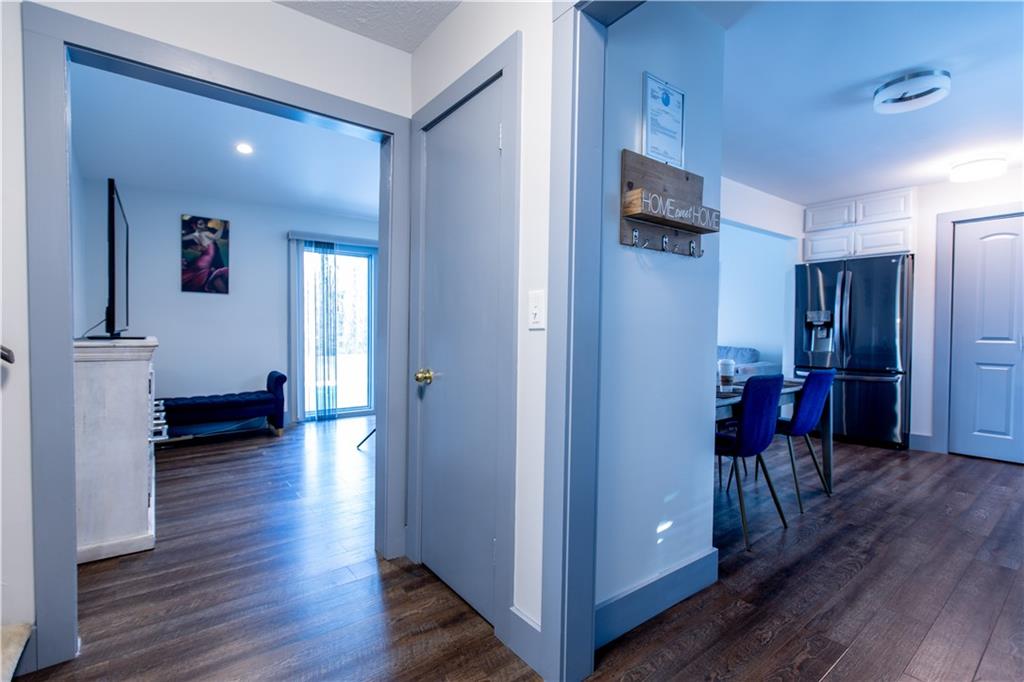 4735 North Springs Road Northwest Kennesaw, GA 30144 - Photo 25 of 34 a view of a hallway with wooden floor windows and livingroom with wooden floor