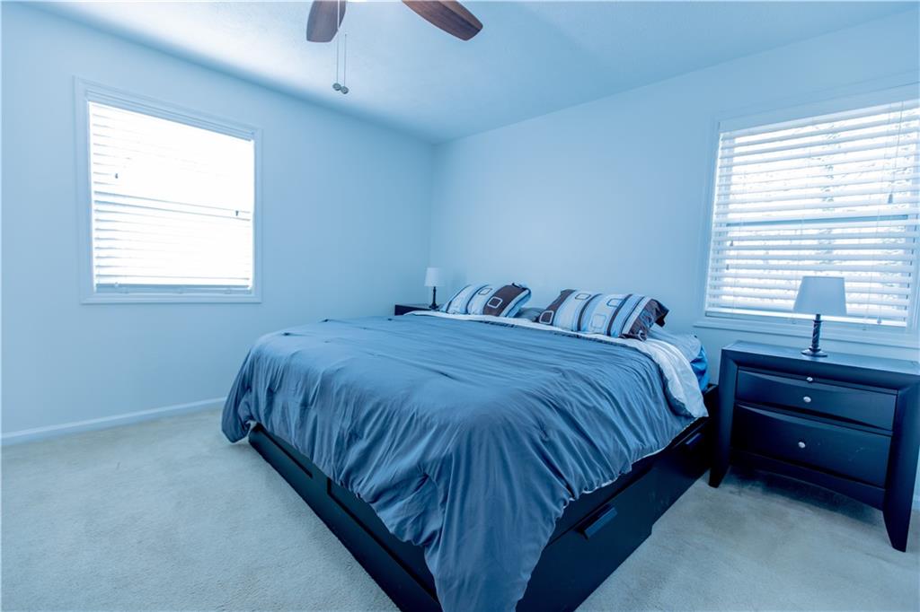 4735 North Springs Road Northwest Kennesaw, GA 30144 - Photo 29 of 34 a bedroom with a bed and a window