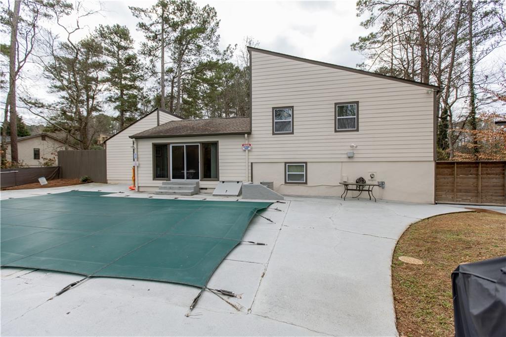 4735 North Springs Road Northwest Kennesaw, GA 30144 - Photo 32 of 34 a front view of a house with garden