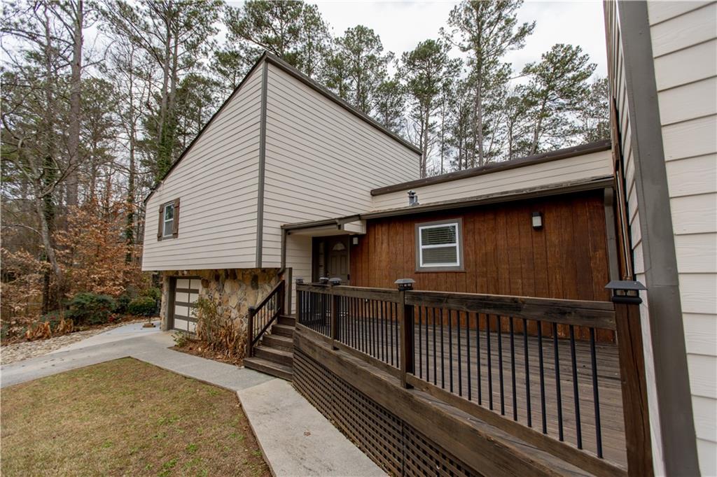 4735 North Springs Road Northwest Kennesaw, GA 30144 - Photo 5 of 34 a view of a house with a patio