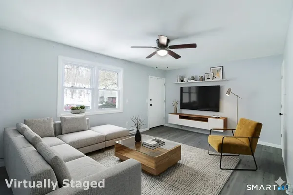 a living room with furniture and a flat screen tv