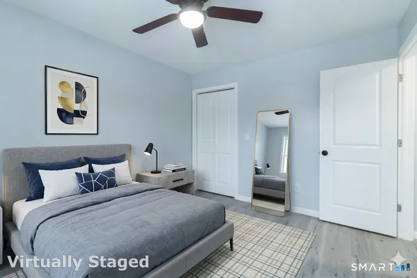 a bedroom with bed and window