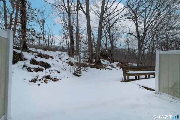 a view of a bench in snow