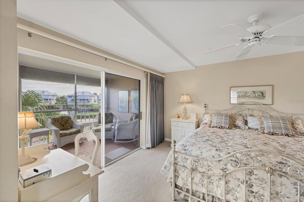 11000 Placida Road, Unit 1801 Placida, FL 33946 - Photo 16 of 53 a bedroom with furniture and large window