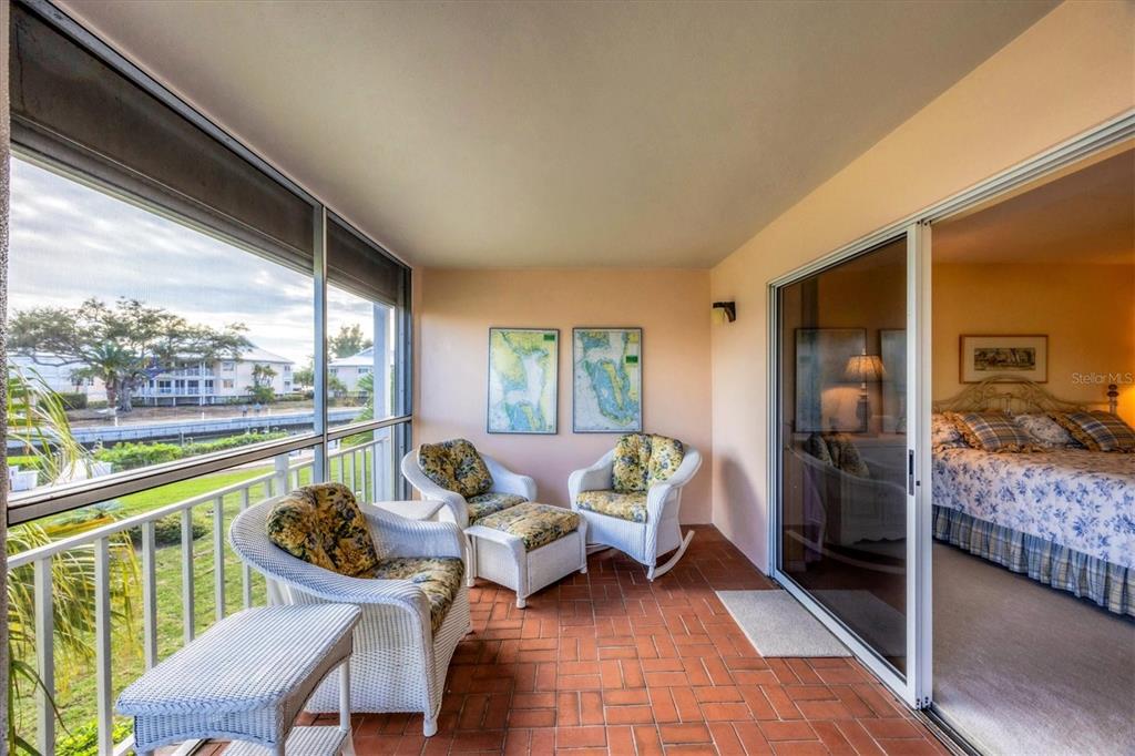 11000 Placida Road, Unit 1801 Placida, FL 33946 - Photo 17 of 53 a living room with furniture and a large window