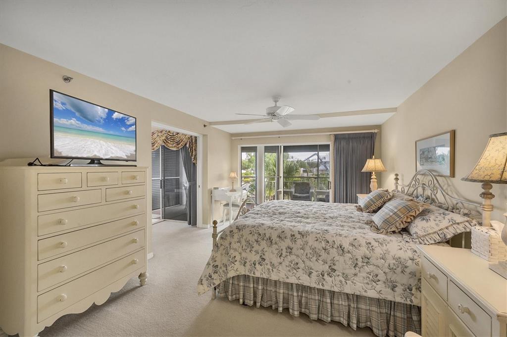 11000 Placida Road, Unit 1801 Placida, FL 33946 - Photo 18 of 53 a bedroom with a bed and a flat screen tv