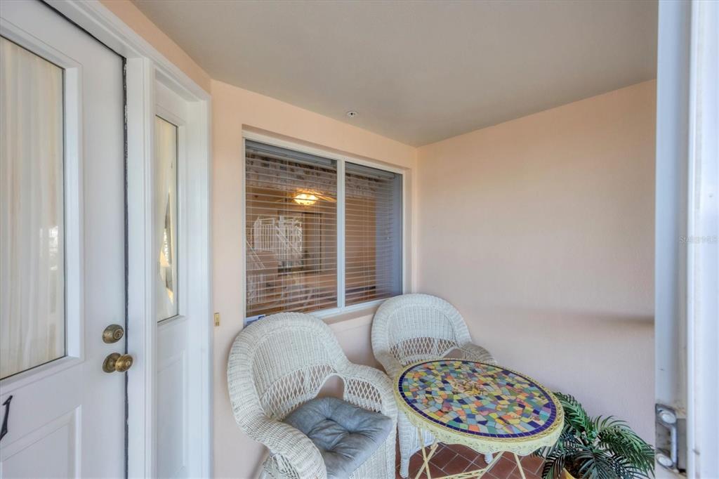 11000 Placida Road, Unit 1801 Placida, FL 33946 - Photo 2 of 53 a living room with furniture and a table