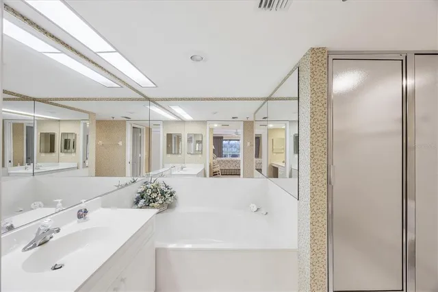 a bathroom with a sink and mirror