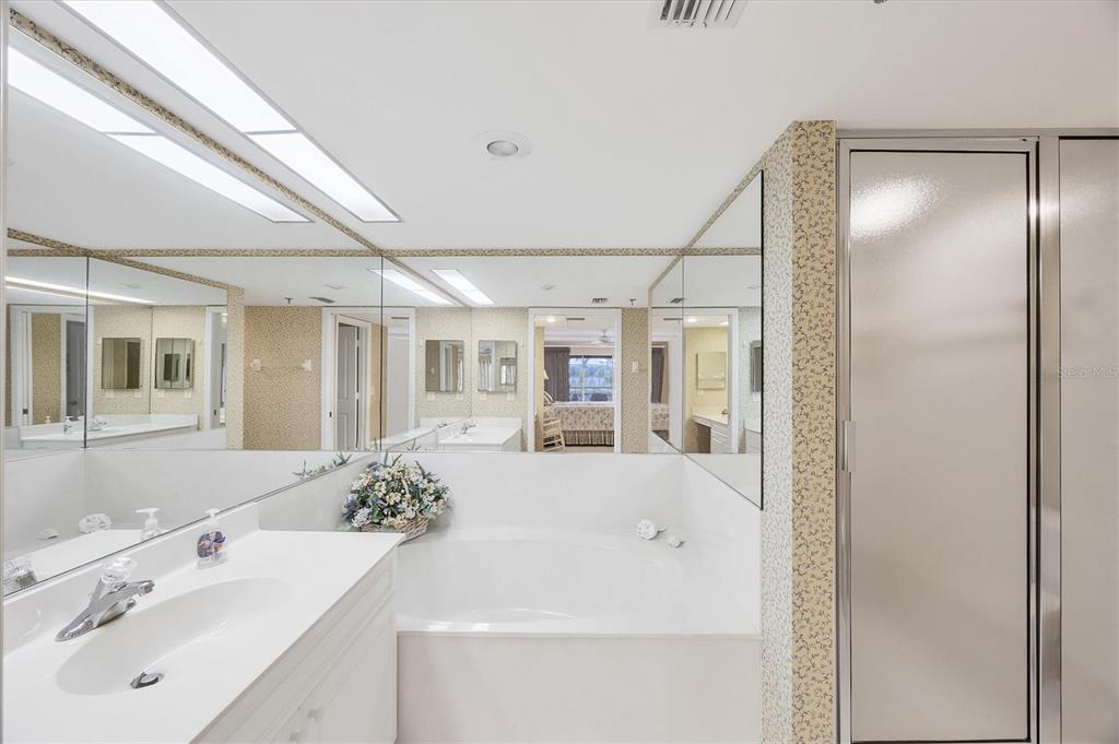 11000 Placida Road, Unit 1801 Placida, FL 33946 - Photo 21 of 53 a bathroom with a sink and mirror