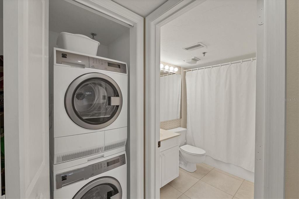 11000 Placida Road, Unit 1801 Placida, FL 33946 - Photo 25 of 53 a view of a hallway with washer and dryer