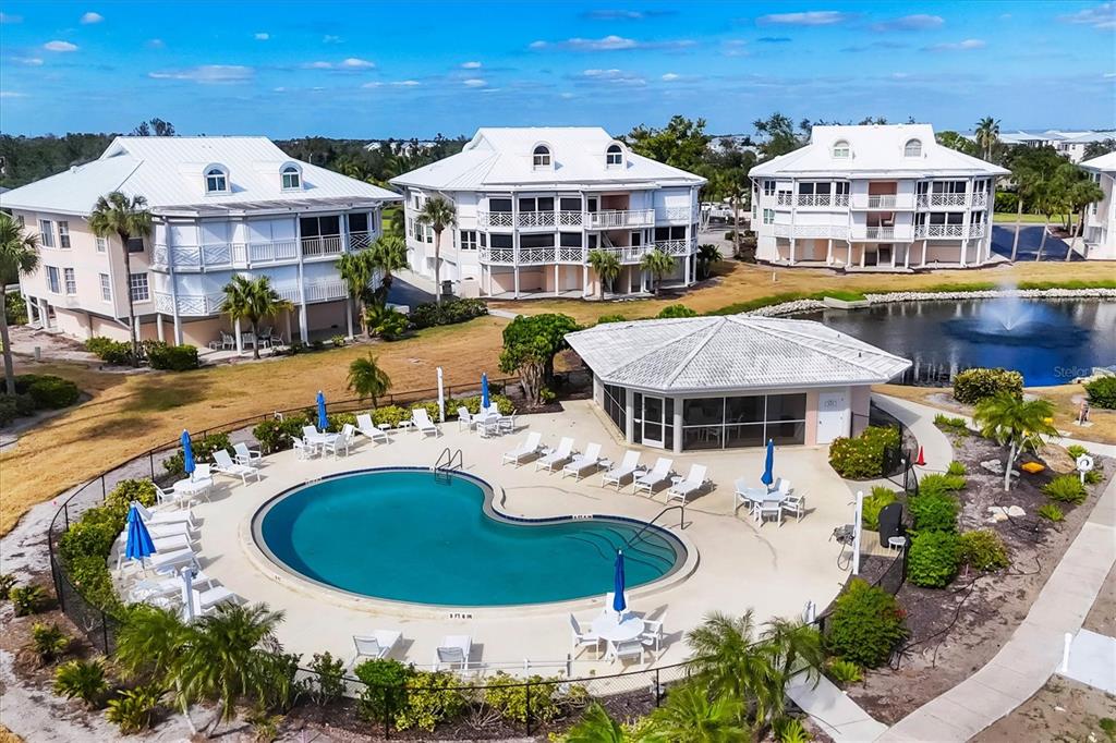 11000 Placida Road, Unit 1801 Placida, FL 33946 - Photo 37 of 53 an aerial view of a house with swimming pool outdoor seating